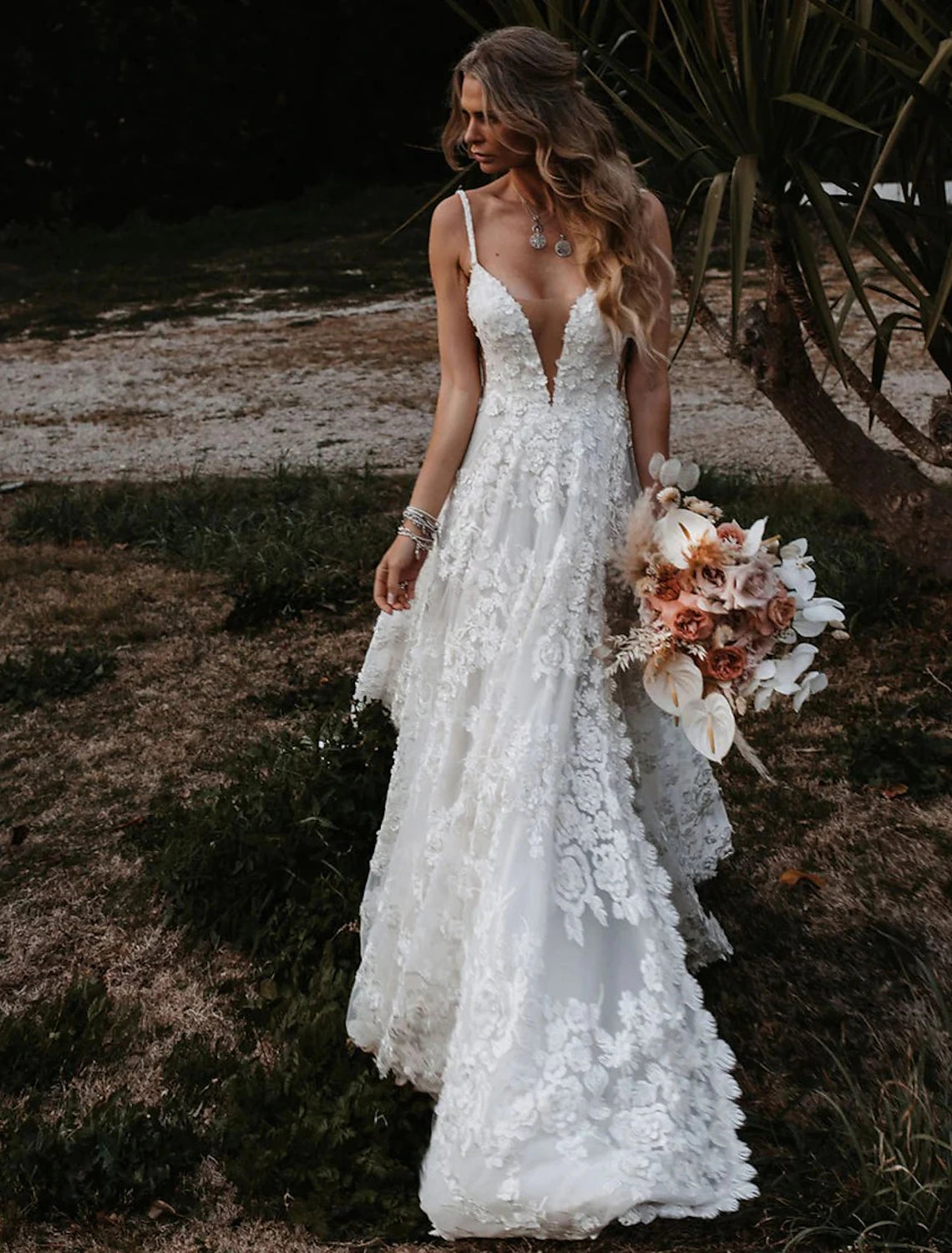 Boho A-line wedding dress with sweetheart neckline and lace appliques.