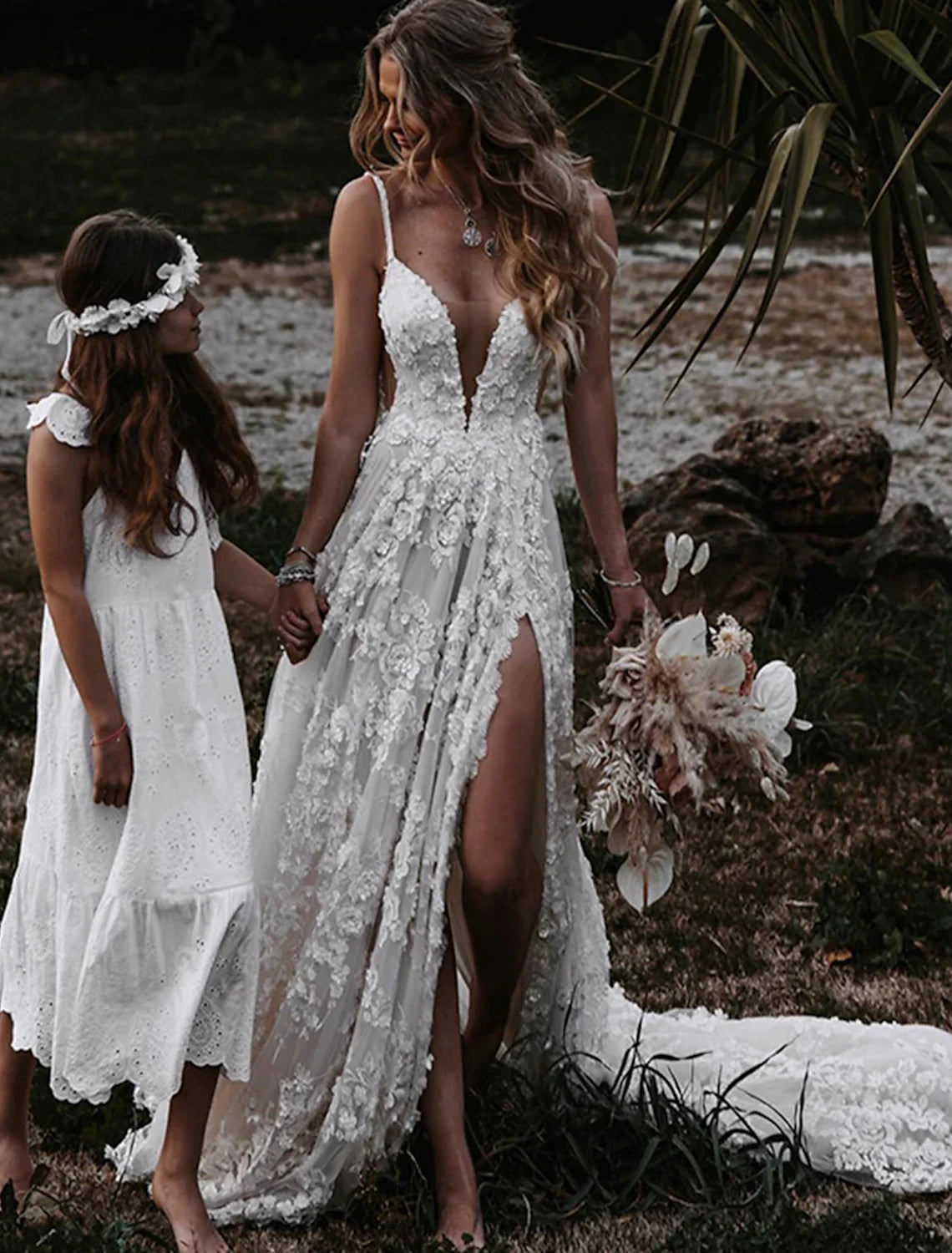 Back view of boho wedding dress showing court train and spaghetti straps.