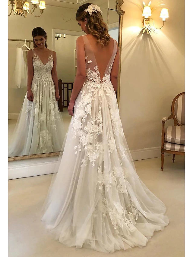 Back view of a sleeveless A-line wedding dress with lace details.