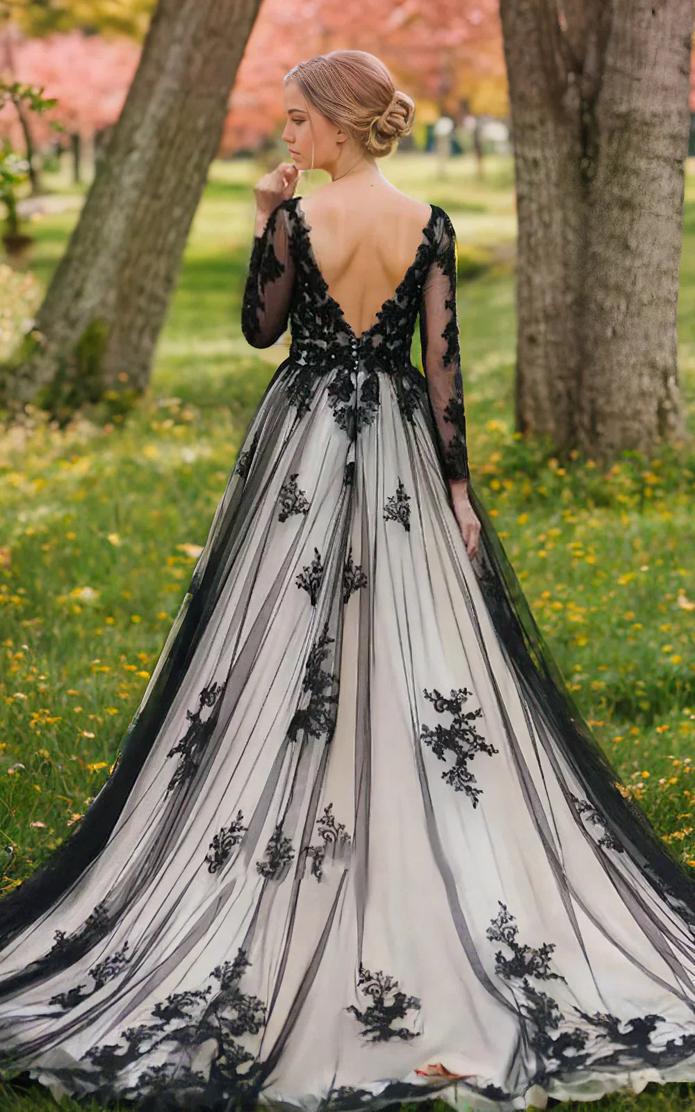 Back view of boho A-line V-neck lace wedding dress showing backless detail and court train.
