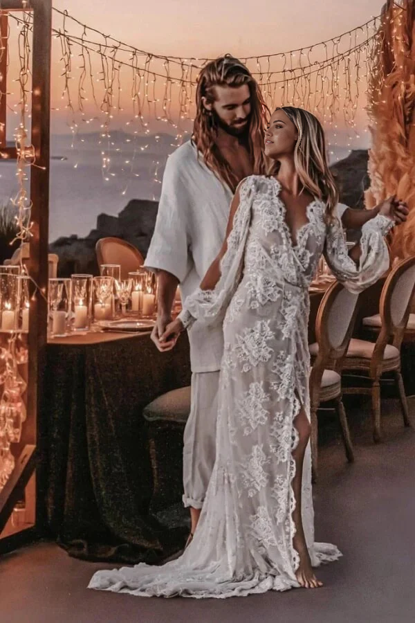 Boho A-line V-neck wedding dress with long lace sleeves.