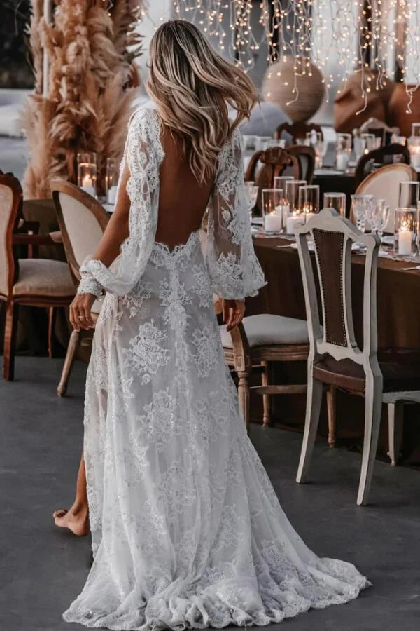 Back view of a bride wearing a long sleeve lace wedding gown.