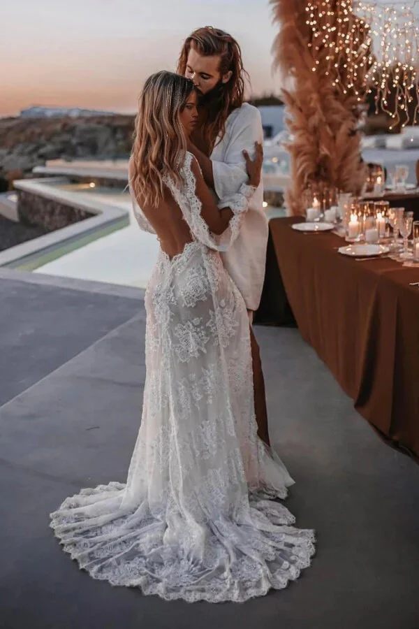 Close-up of lace appliques on the long sleeve of a wedding dress.