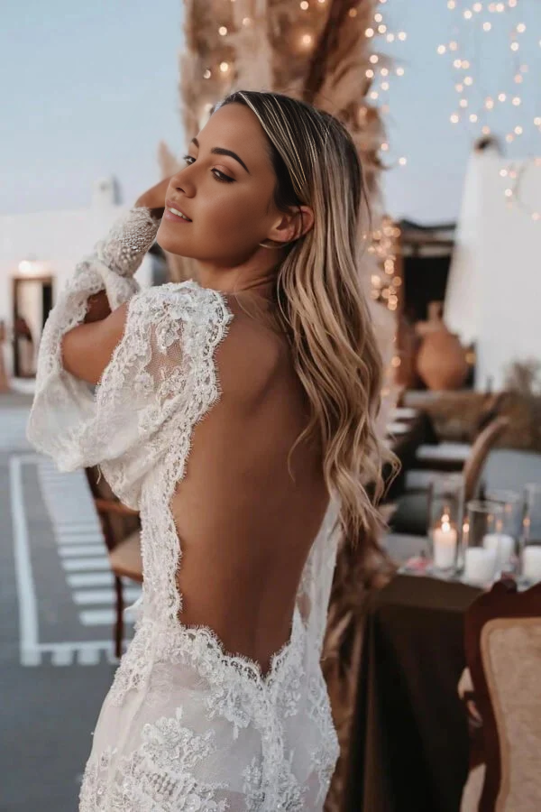 Side view of a bride in a flowing Boho wedding dress.