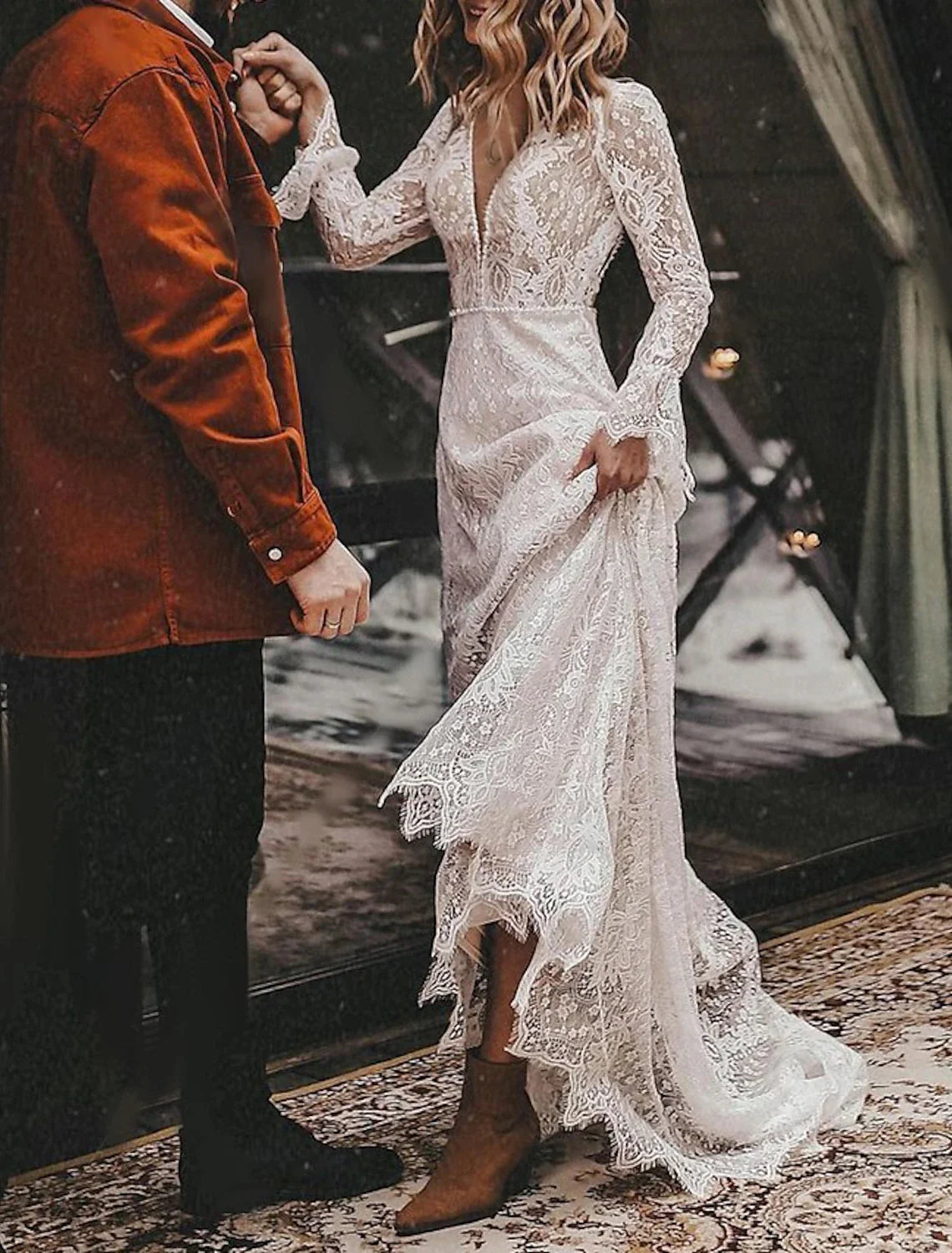 Back view of an A-line boho wedding dress showcasing the open back and lace details.