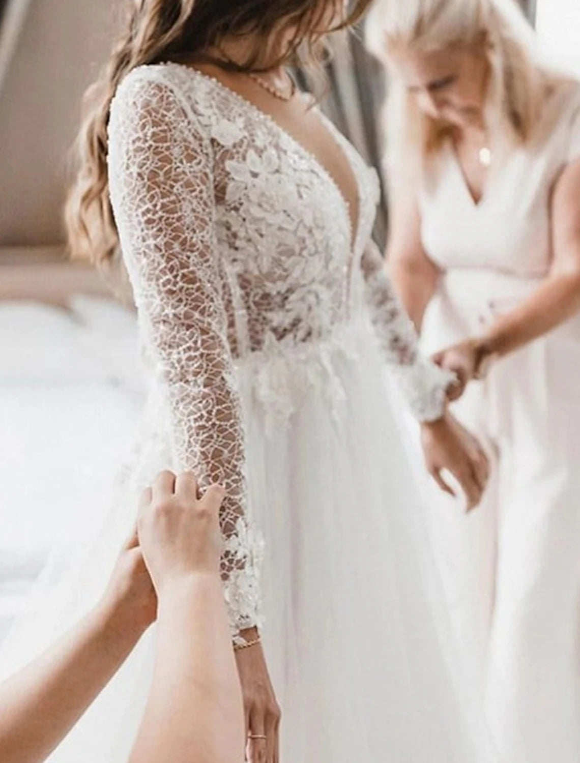 Back view of the boho wedding dress, showing the court train and applique details.