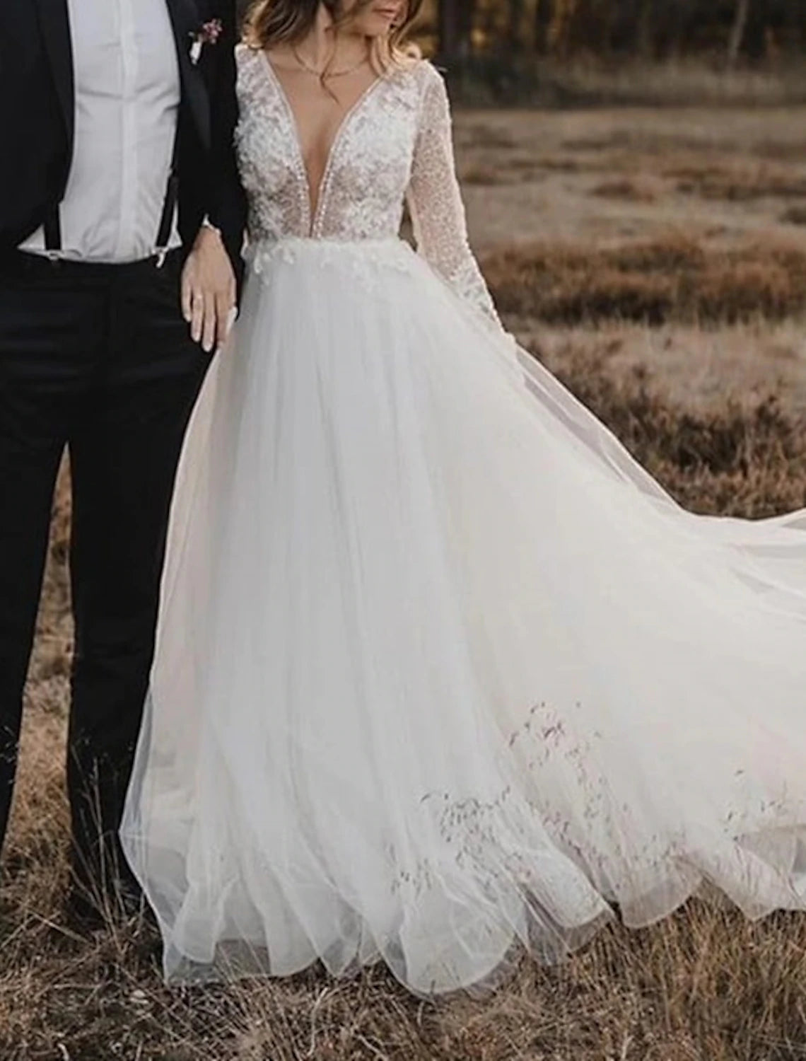 Side view of the A-line boho wedding dress, highlighting the silhouette and lace.