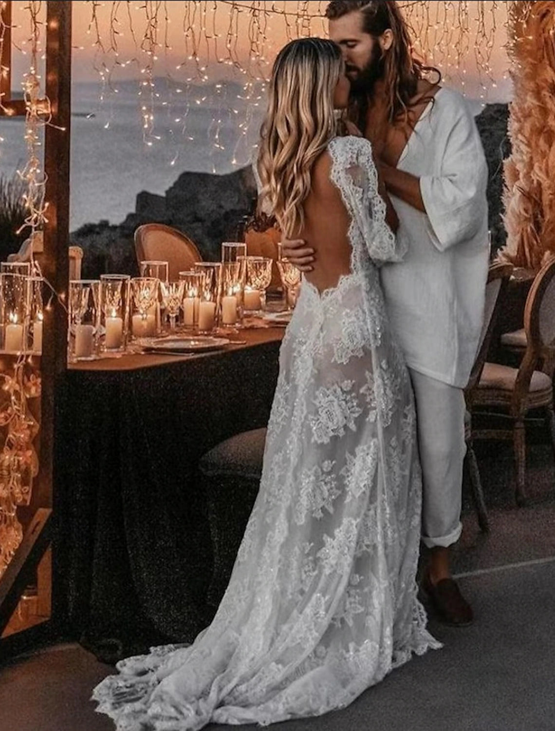 Model posing in the boho A-line wedding dress, highlighting the split front.