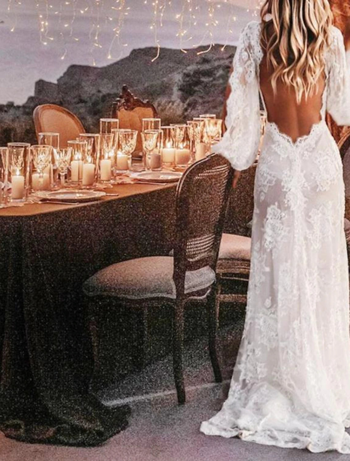 Full length view of the boho A-line V-neck long sleeve wedding gown.