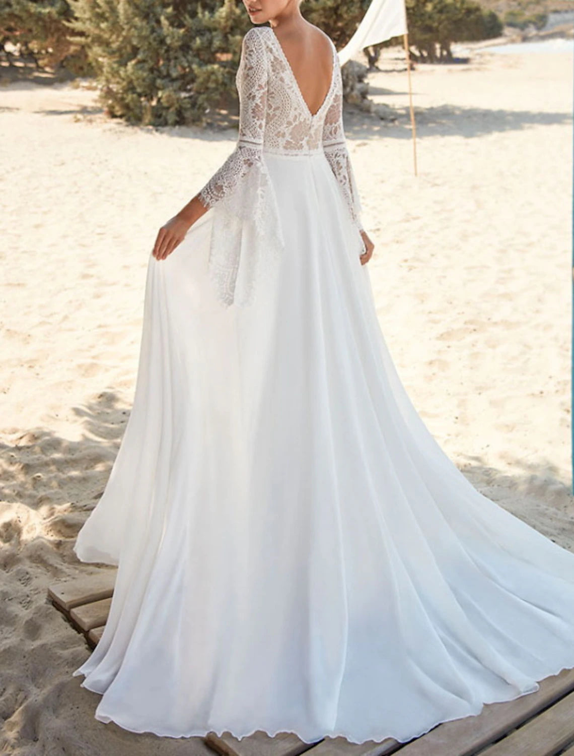 Close-up of pleated chiffon fabric on a wedding dress.
