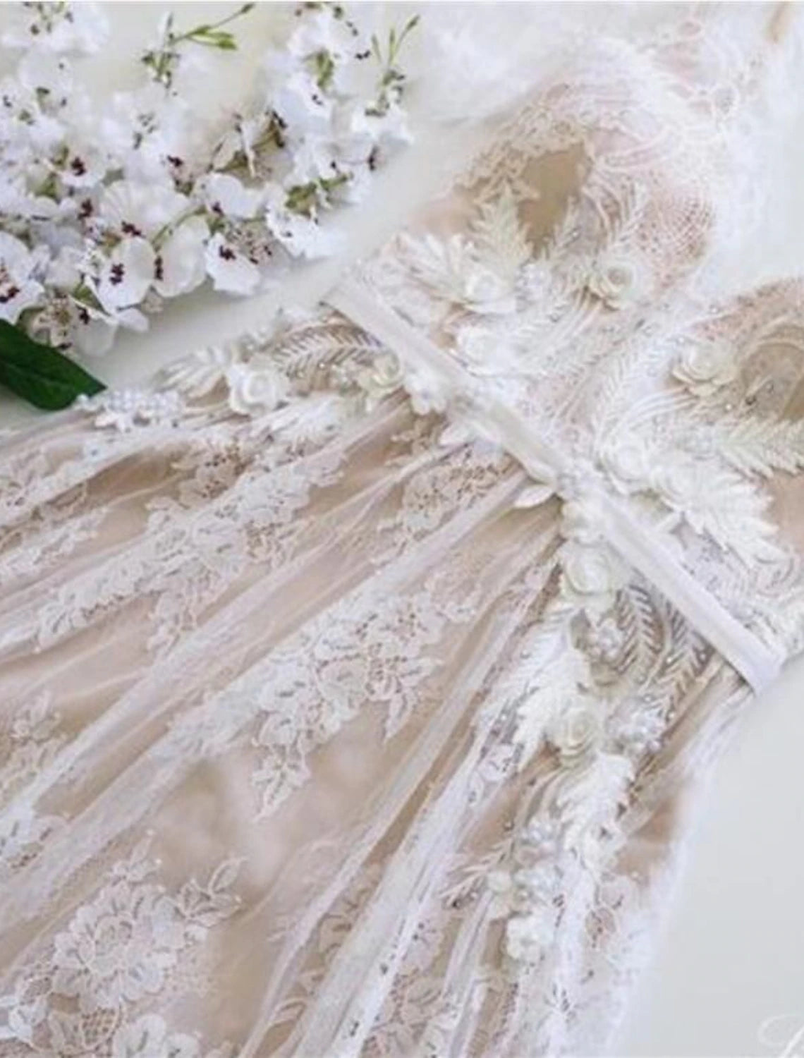 Boho A-Line V-Neck short sleeve lace wedding dress with appliques and sweep train.