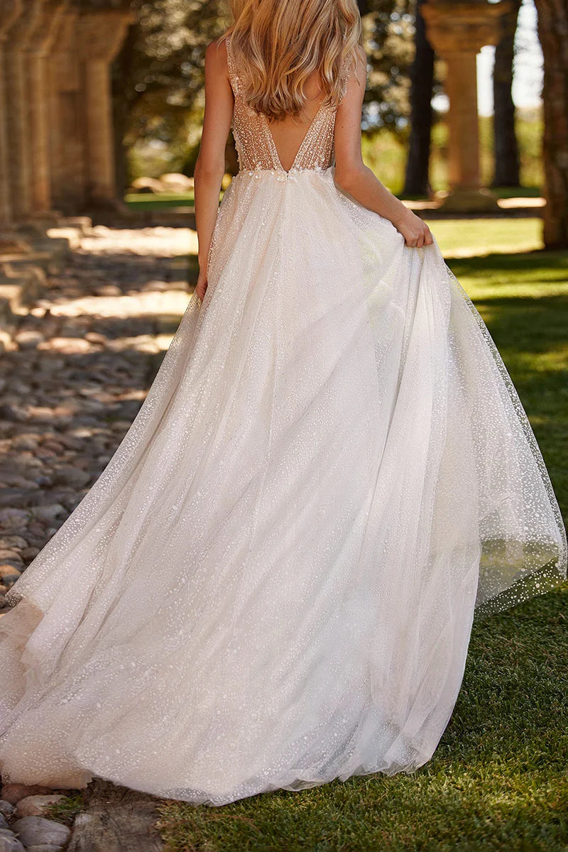 Back view of a bohemian A-line wedding dress featuring delicate appliques.