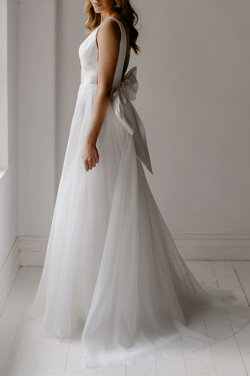 Close-up of the deep V-neckline on a bohemian wedding dress.