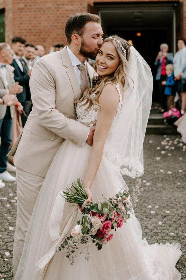 Side view of an elegant off-the-shoulder champagne wedding dress.