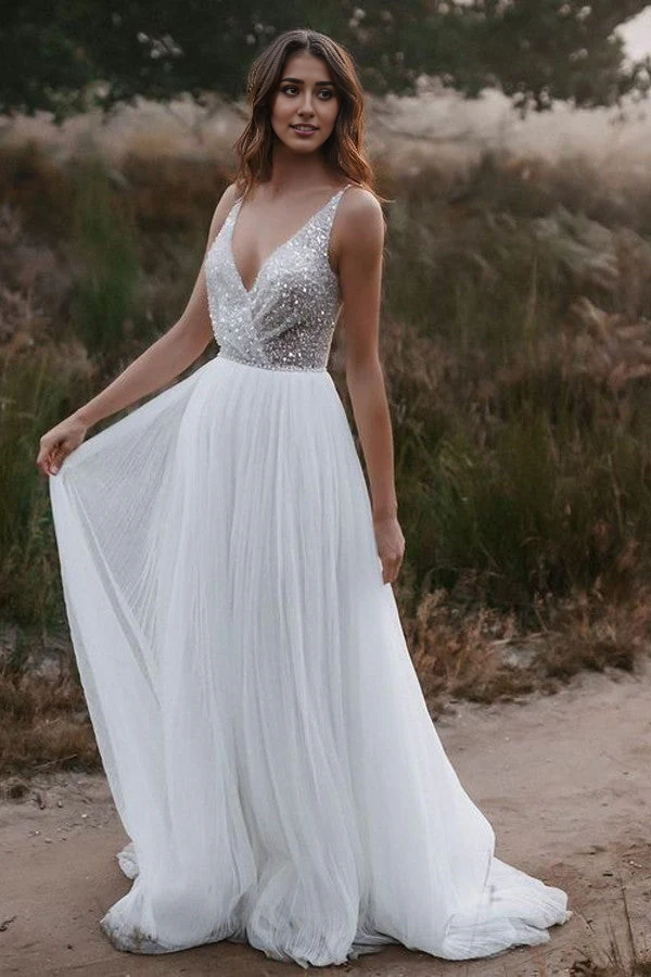 Model wearing a long A-line Boho V-neck glitter tulle wedding dress.