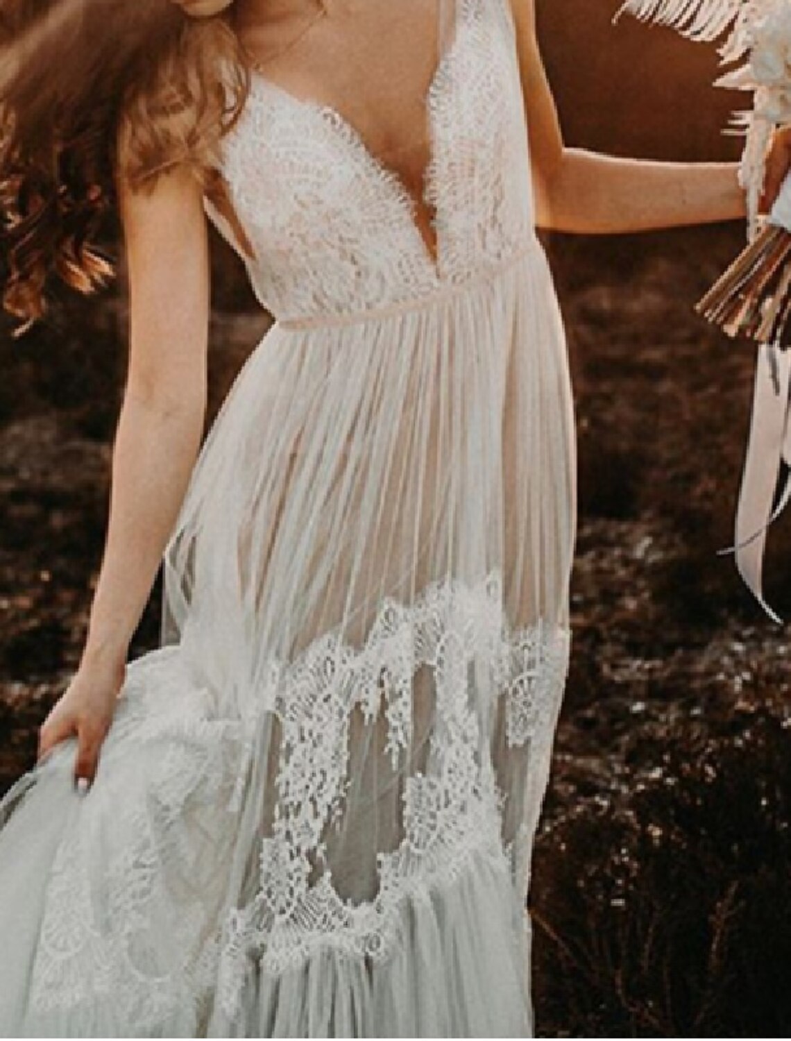 Side view of the model in the A-Line V-Neck lace wedding dress, highlighting the silhouette.