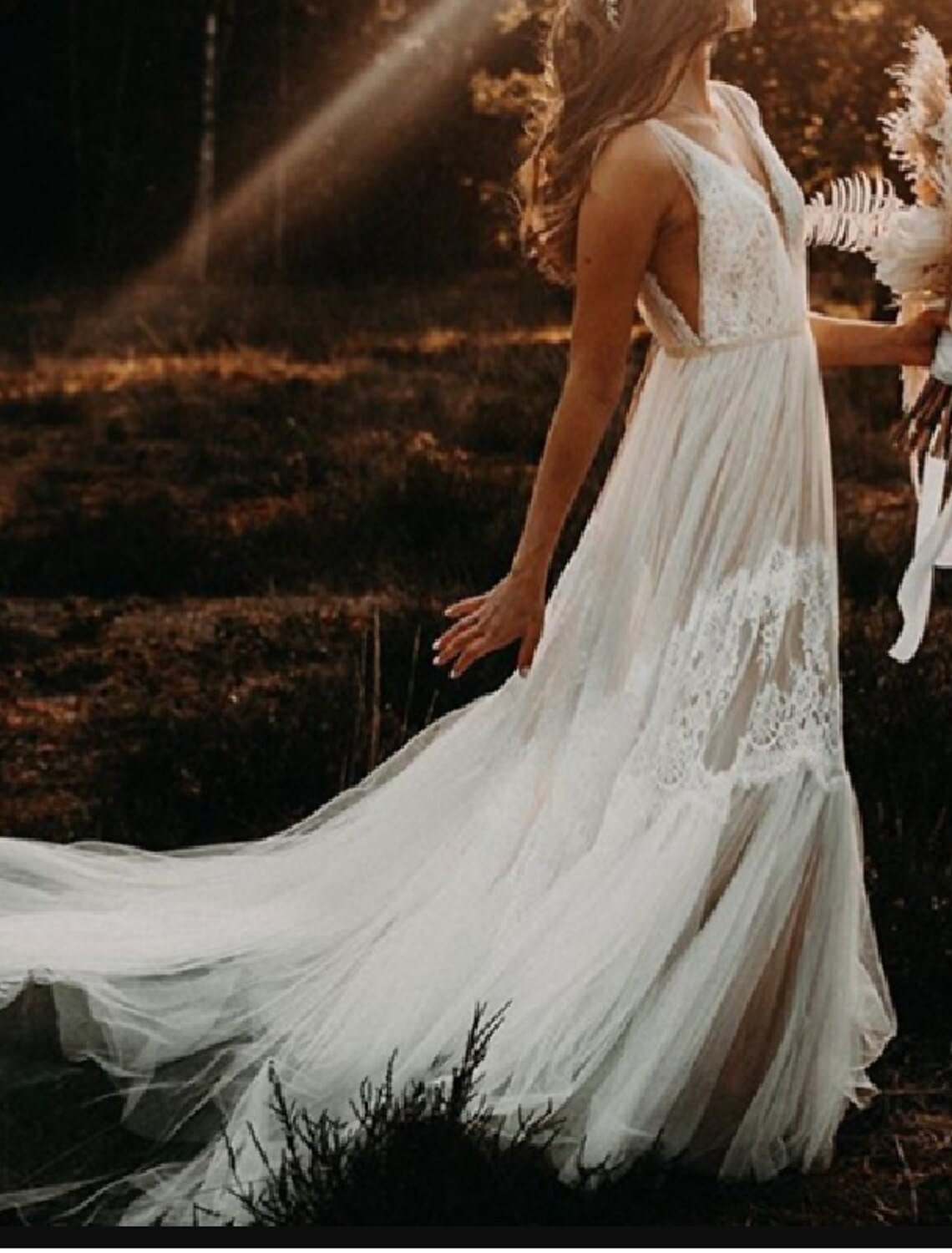 Model posing elegantly in the Boho Beach A-Line V-Neck wedding dress.
