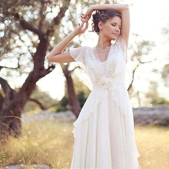 Full view of a floor-length Boho beach wedding gown, showcasing its flowing A-line silhouette.