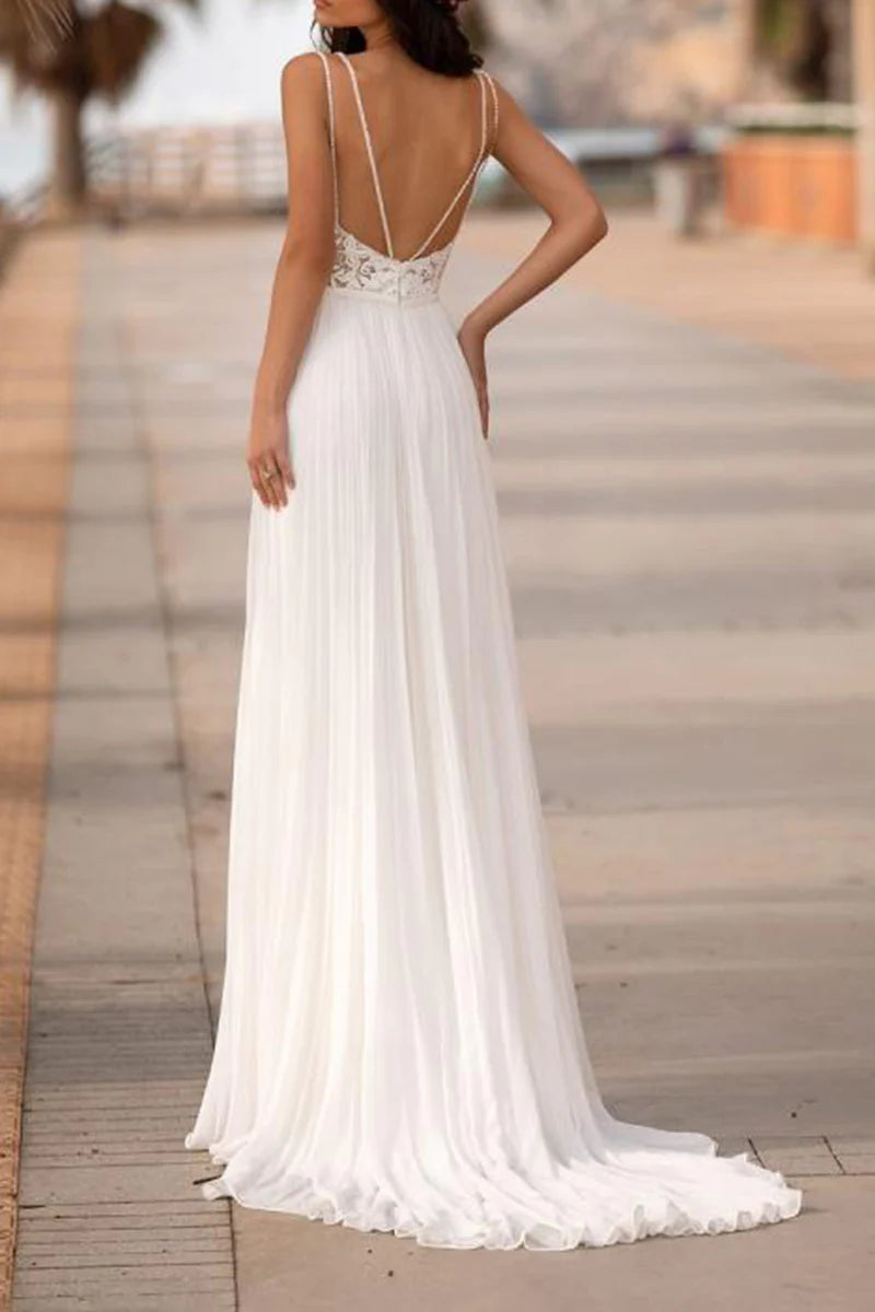 Back view of a bohemian A-line wedding dress with delicate lace details.