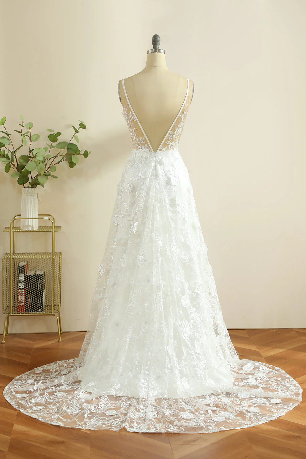 Side view of a white maxi boho wedding dress with a flowing skirt.