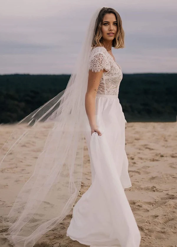 Back view of the Boho A-Line V-Neck wedding dress, showcasing lace and flowy chiffon.
