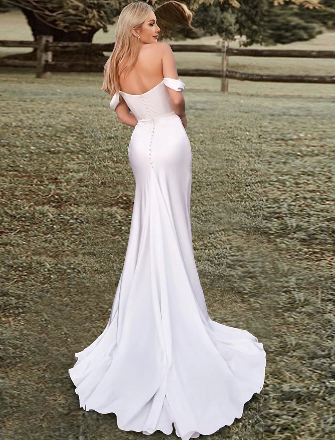 Mermaid wedding gown with elegant side split and ruched details.