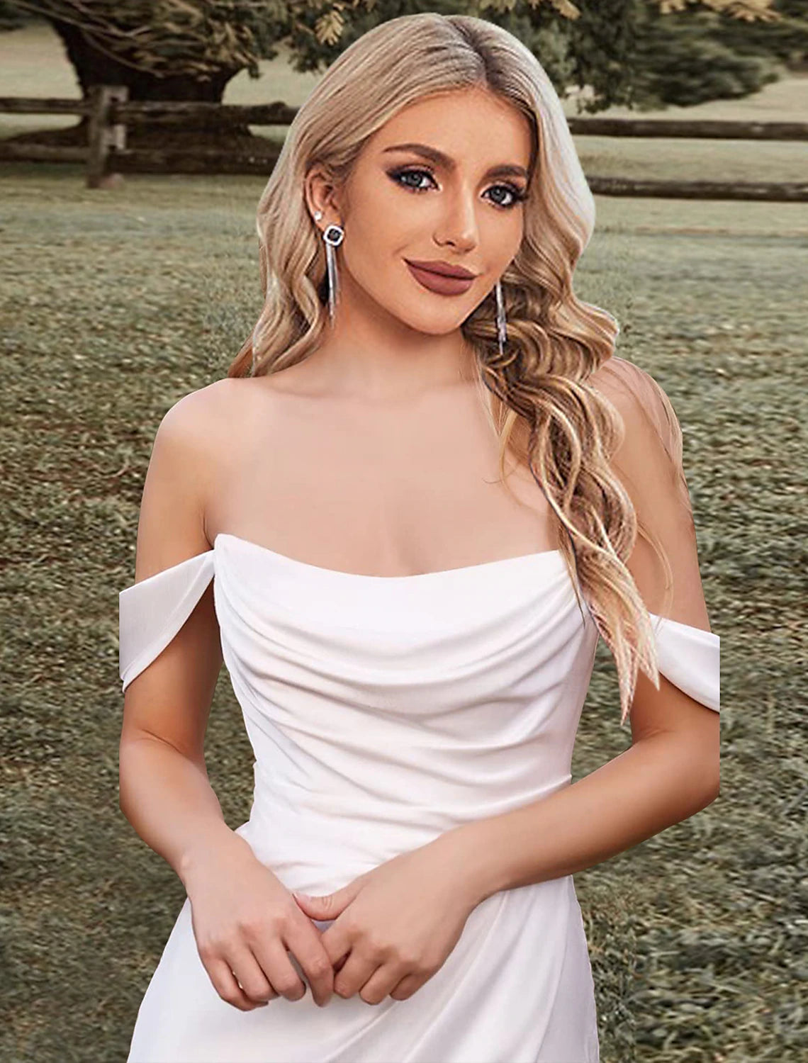 Off-shoulder sleeveless bridal dress made from stretch fabric.