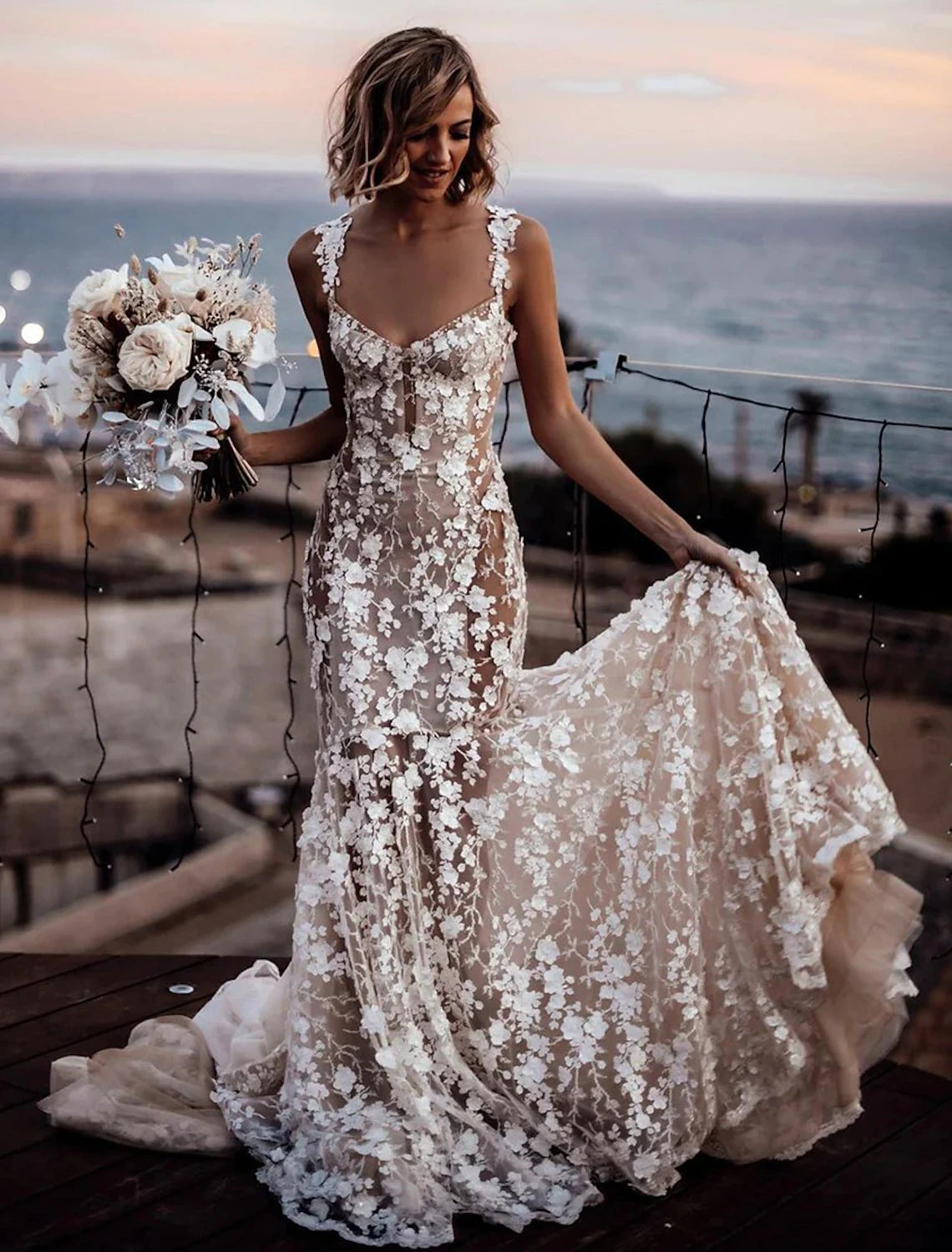 Elegant boho wedding dress with sweetheart neckline and mermaid silhouette.