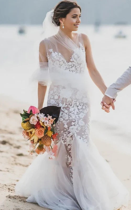 Boho Mermaid V-neck wedding dress with lace appliques, front view.