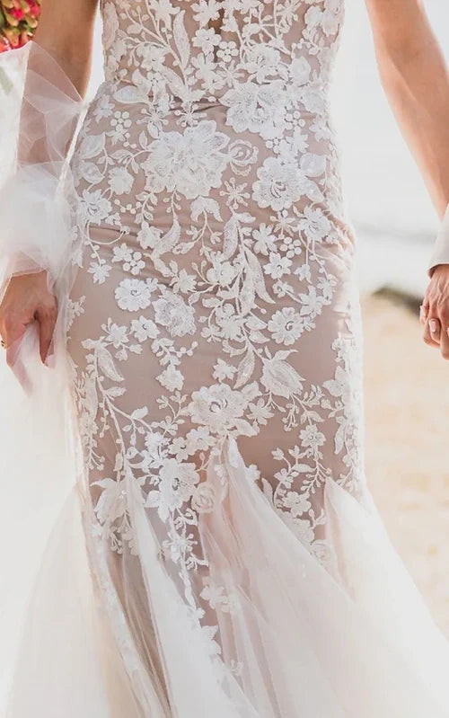 Side profile of a bride wearing a vintage beach wedding gown.
