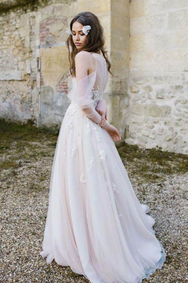 Woman posing in the Boho Rustic V-Neck Long Sleeve Cold Shoulder Beach Wedding Dress.