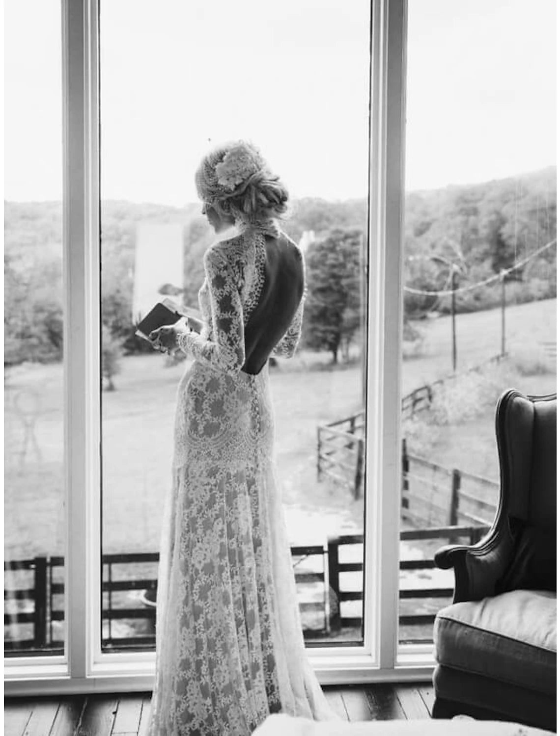 Close-up of the high neck and long lace sleeves on a white bridal gown.