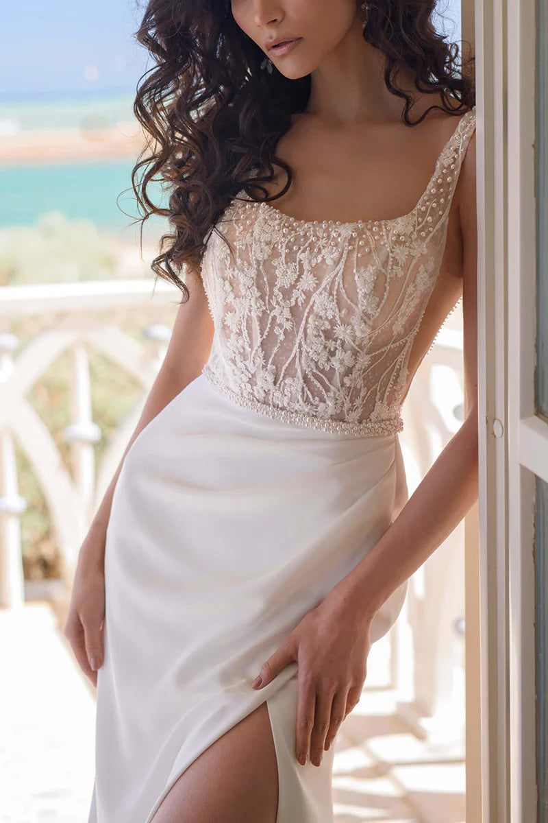 Back view of the sleeveless boho wedding dress, showing the elegant silhouette.