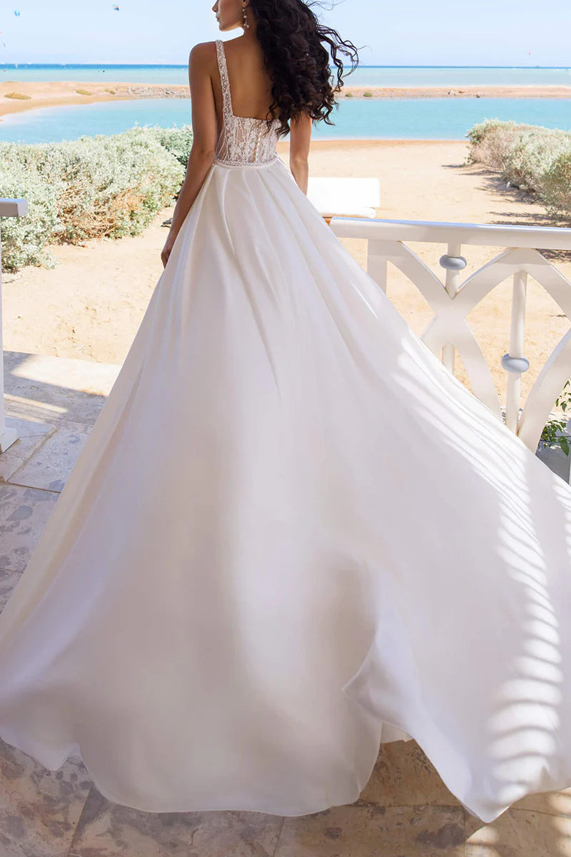 Model walking in the boho wedding dress, highlighting the side slit and flowy skirt.