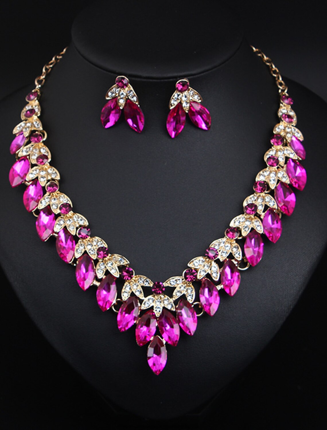 Bridal jewelry set with colorful crystal rhinestone flower necklace and earrings on display.