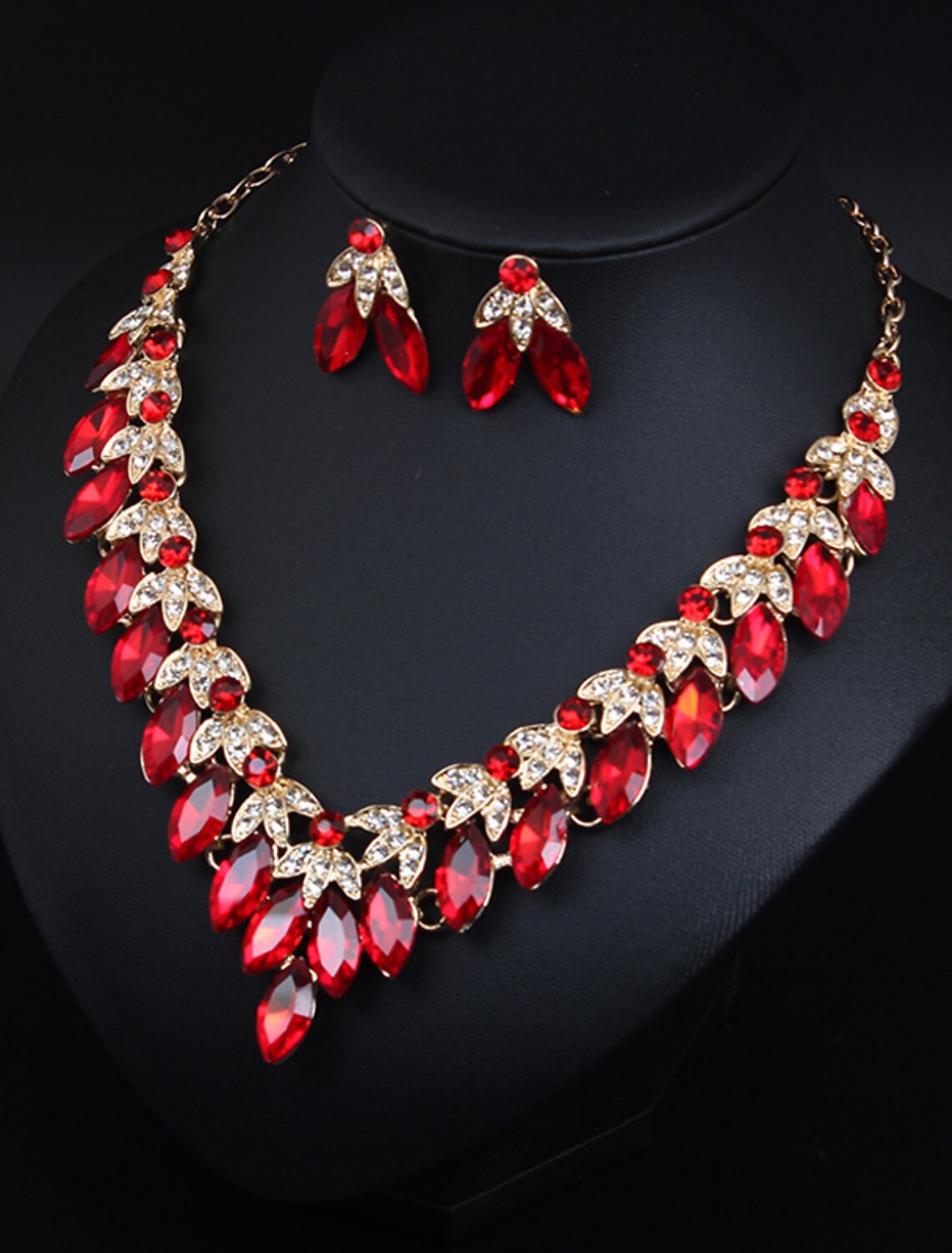 Side view of the crystal rhinestone flower necklace and earrings, showcasing the irregular design.