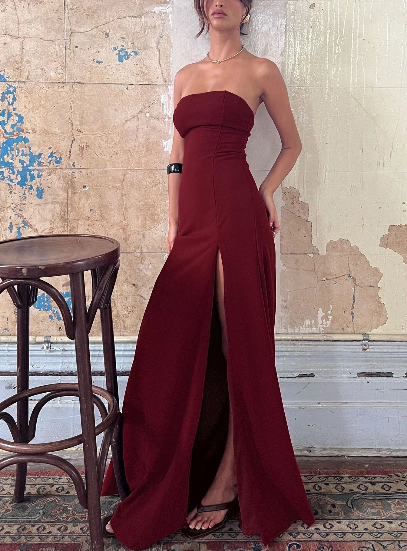 Burgundy Strapless Prom Dress with Front Slit and Form Fitting Silhouette for Formal Events and Prom Nights