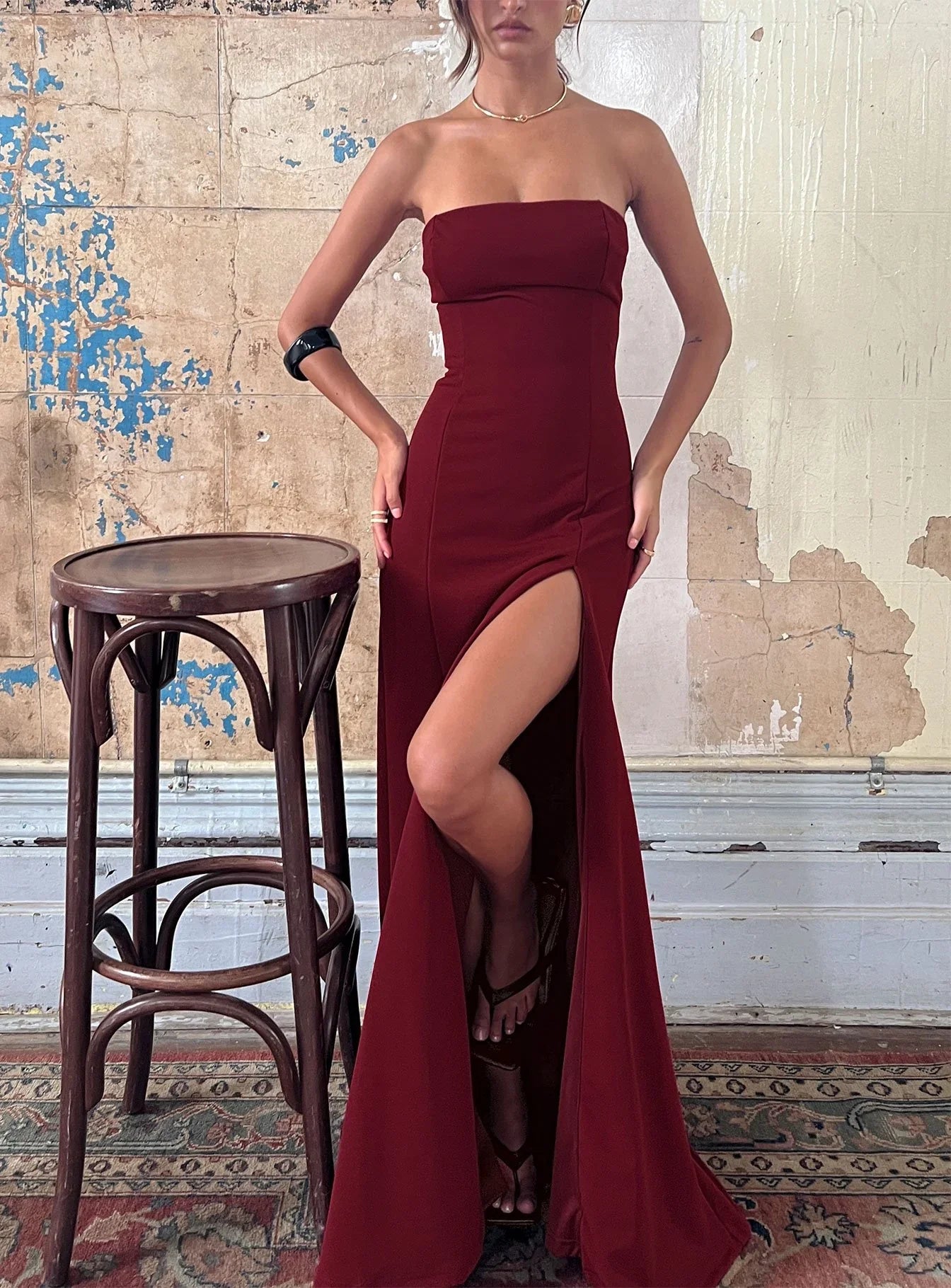 Burgundy Strapless Prom Dress with Front Slit and Form Fitting Silhouette for Formal Events and Prom Nights