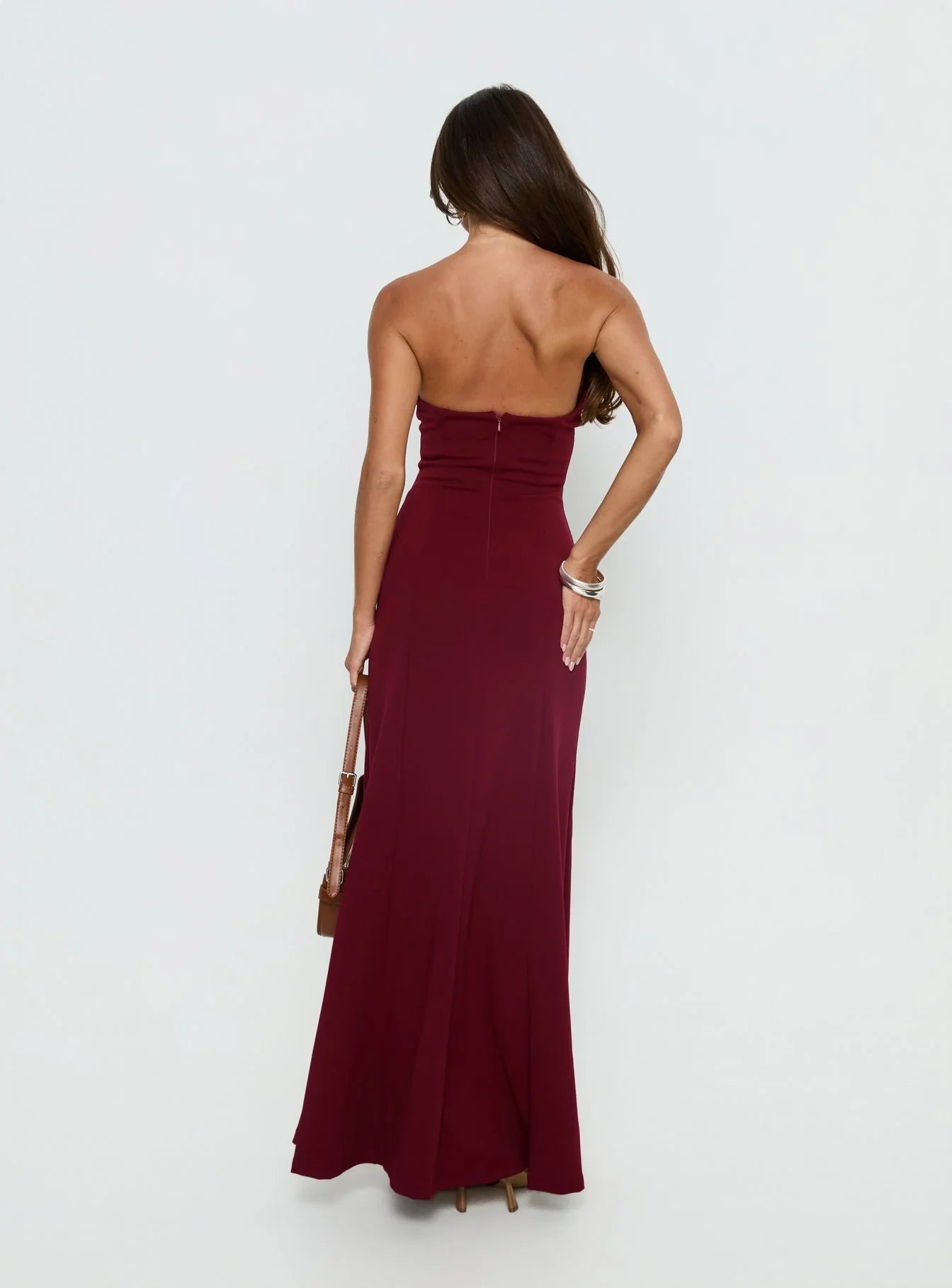 Burgundy Strapless Prom Dress with Front Slit and Form Fitting Silhouette for Formal Events and Prom Nights
