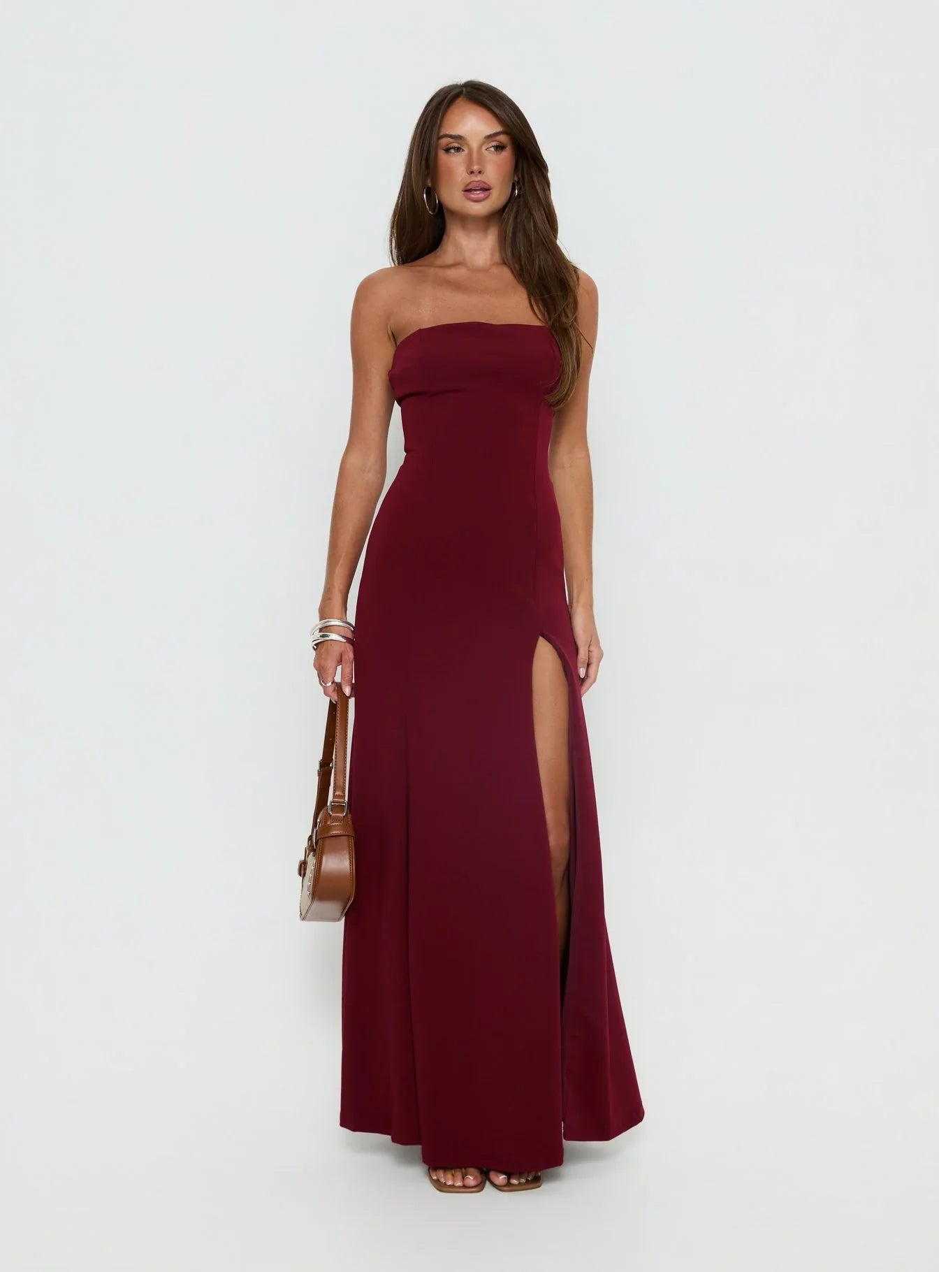 Burgundy Strapless Prom Dress with Front Slit and Form Fitting Silhouette for Formal Events and Prom Nights