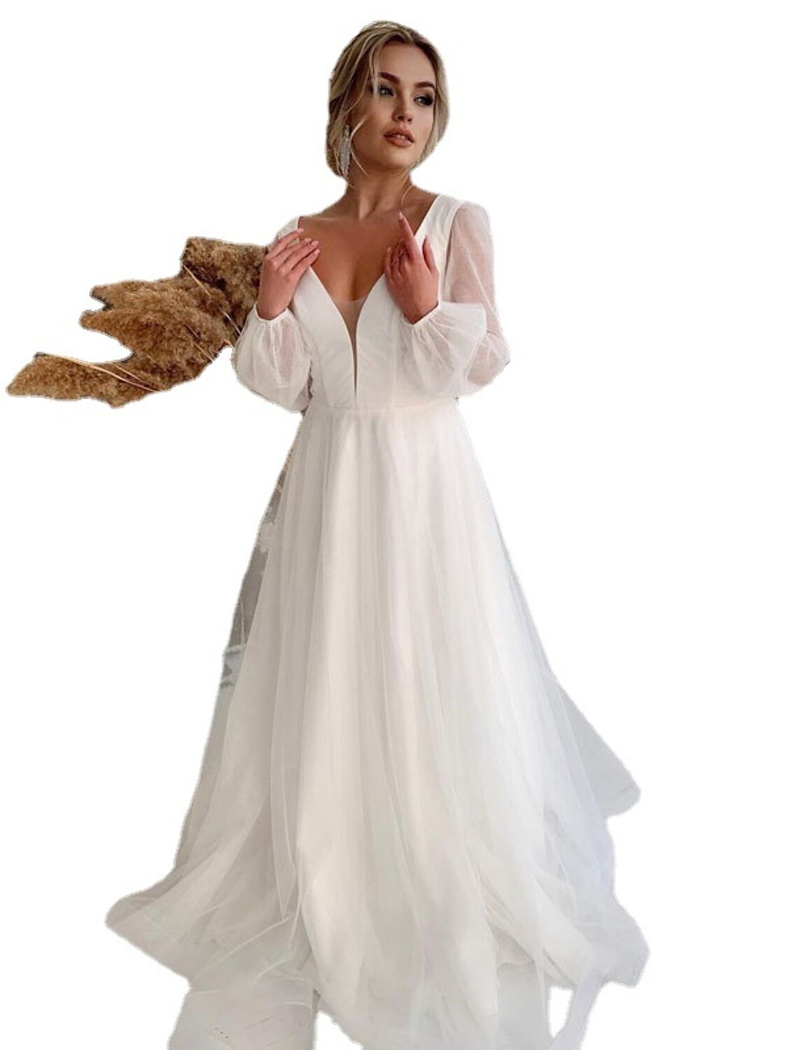 Back view of a white A-line V-neck long sleeve tulle wedding dress.