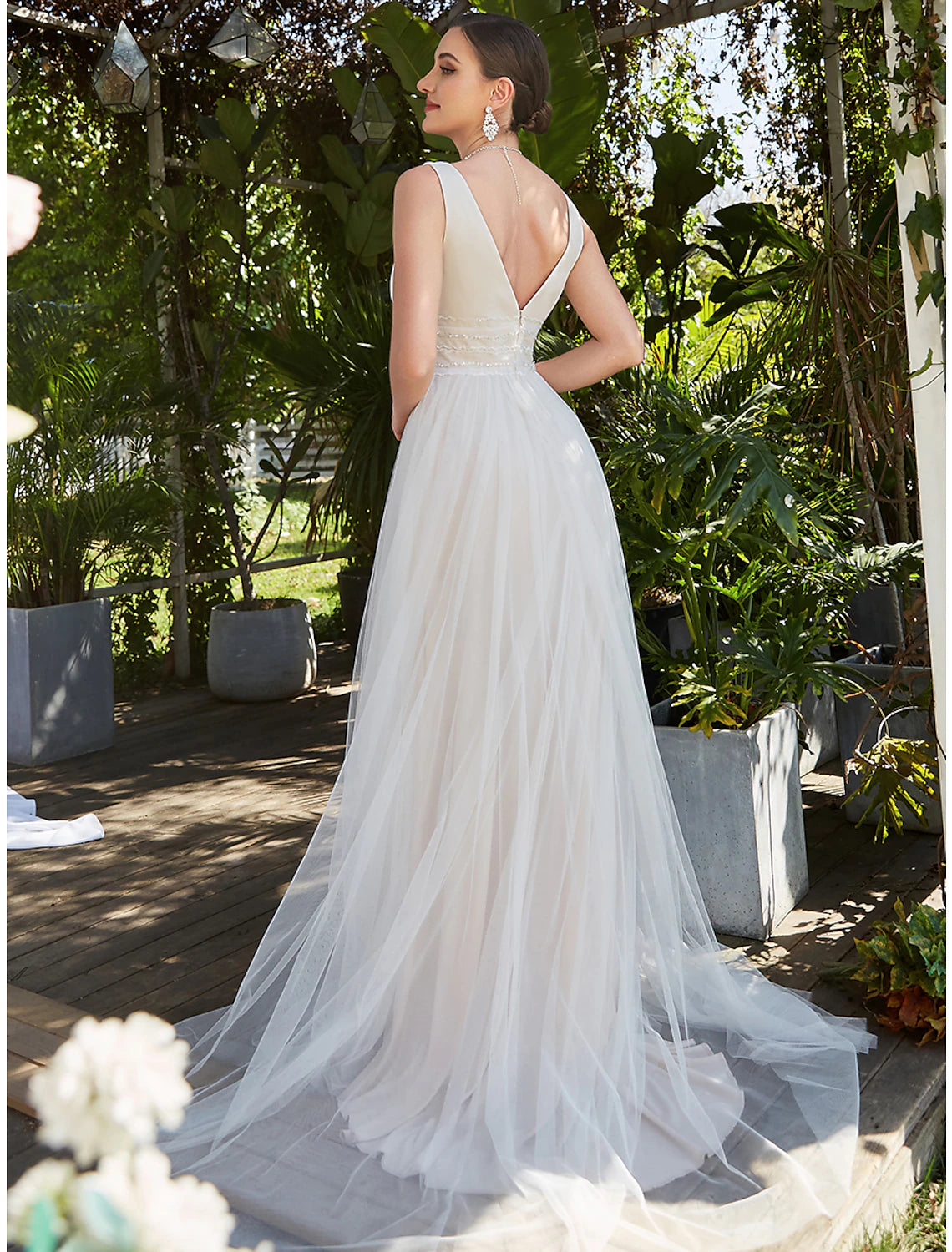 Close-up of the lace embroidery on the V-Neck tulle wedding dress.