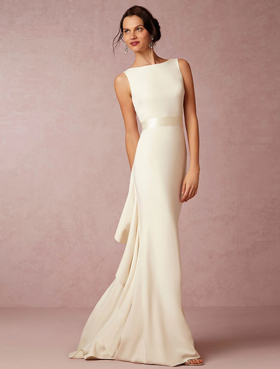 Model wearing Hall casual wedding dress with open back and scoop neck.