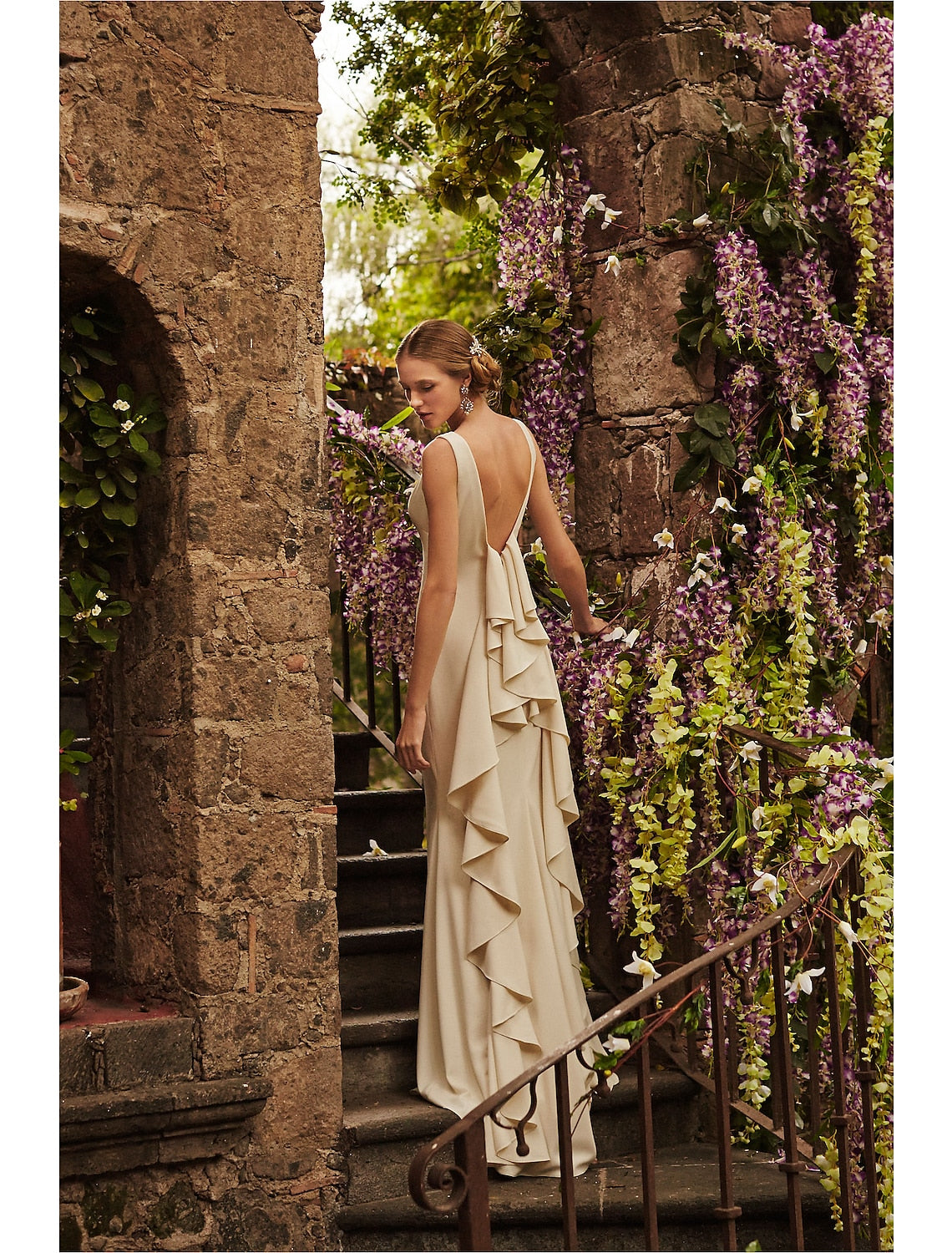 Close-up of the stretch fabric and open back detail on the bridal dress.
