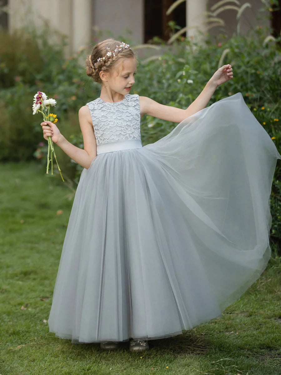 Side view of the A-line tulle flower girl dress, highlighting the applique and sash details.