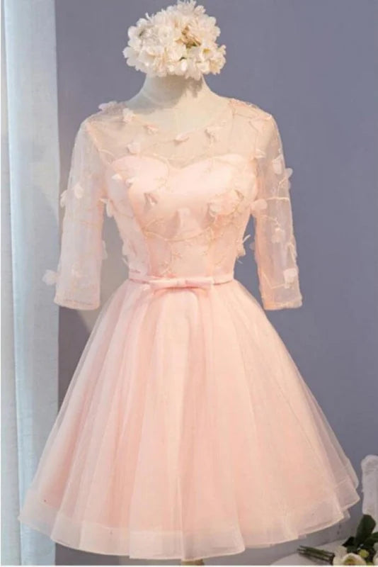 Side view of an A-Line half sleeve tulle prom dress with floral details.