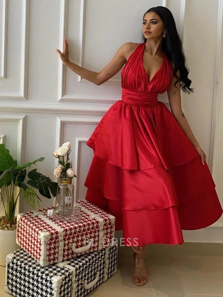Model wearing a charming A-line halter V-neck tiered satin formal dress.
