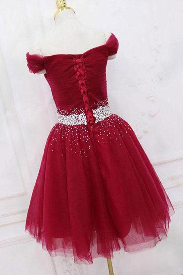 Back view of an A-line off-shoulder tulle homecoming dress with beading.