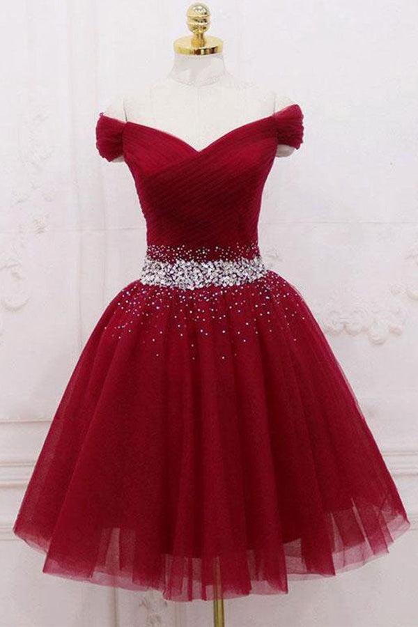 Full length view of an A-line off-shoulder tulle homecoming dress.