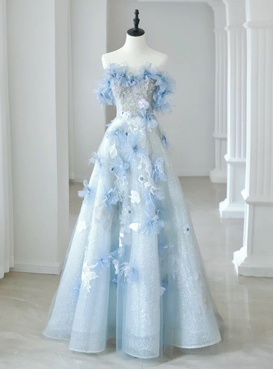 Model wearing a long, off-shoulder A-line prom dress with floral details.